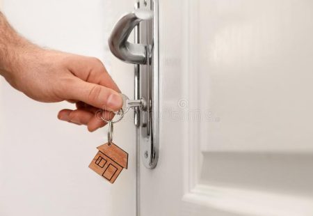 man-key-opening-front-door-closeup-space-text-141042380 (1)